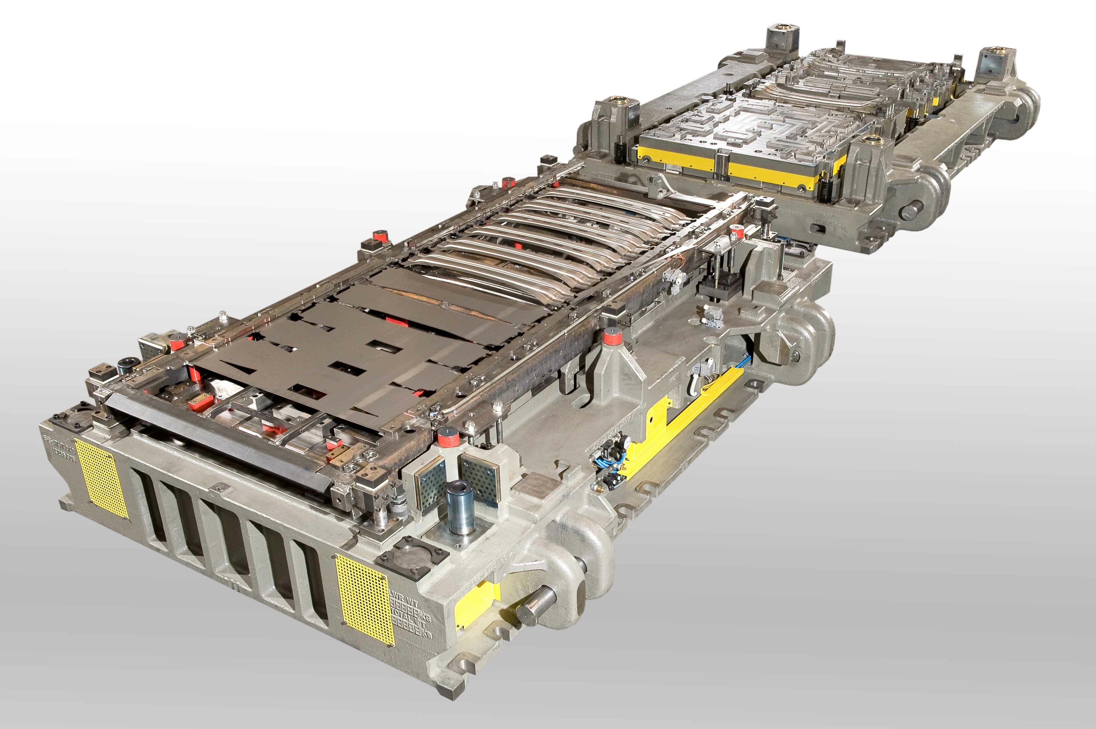 Folgeverbundwerkzeug zur Kaltumformung: Komplexes Werkzeugsystem mit mehreren Umform- und Schneidstufen zur Serienfertigung von Blechbauteilen.