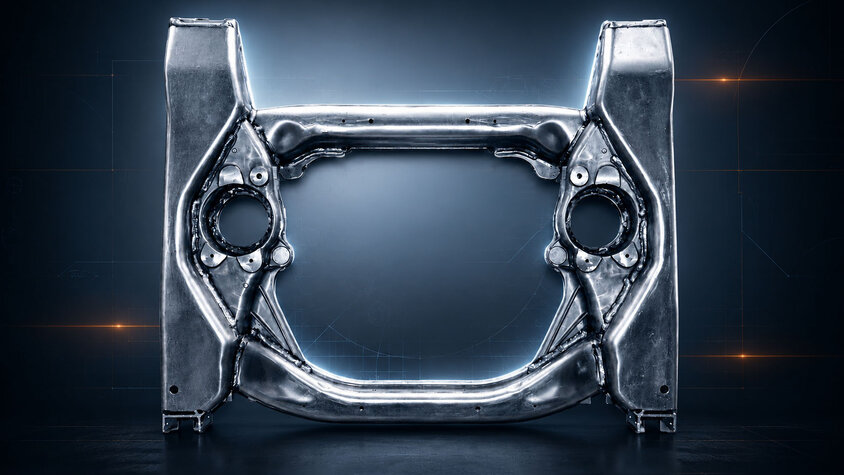 Umgeformtes Aluminium-Strukturbauteil mit komplexer Geometrie vor technischem Hintergrund
